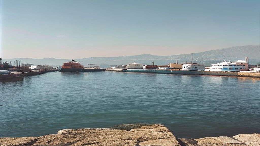 Piraeus port and Athens skyline representing Greece's largest companies