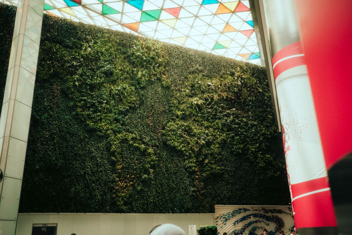 World map installation on a wall at a financial centre, symbolizing global wealth