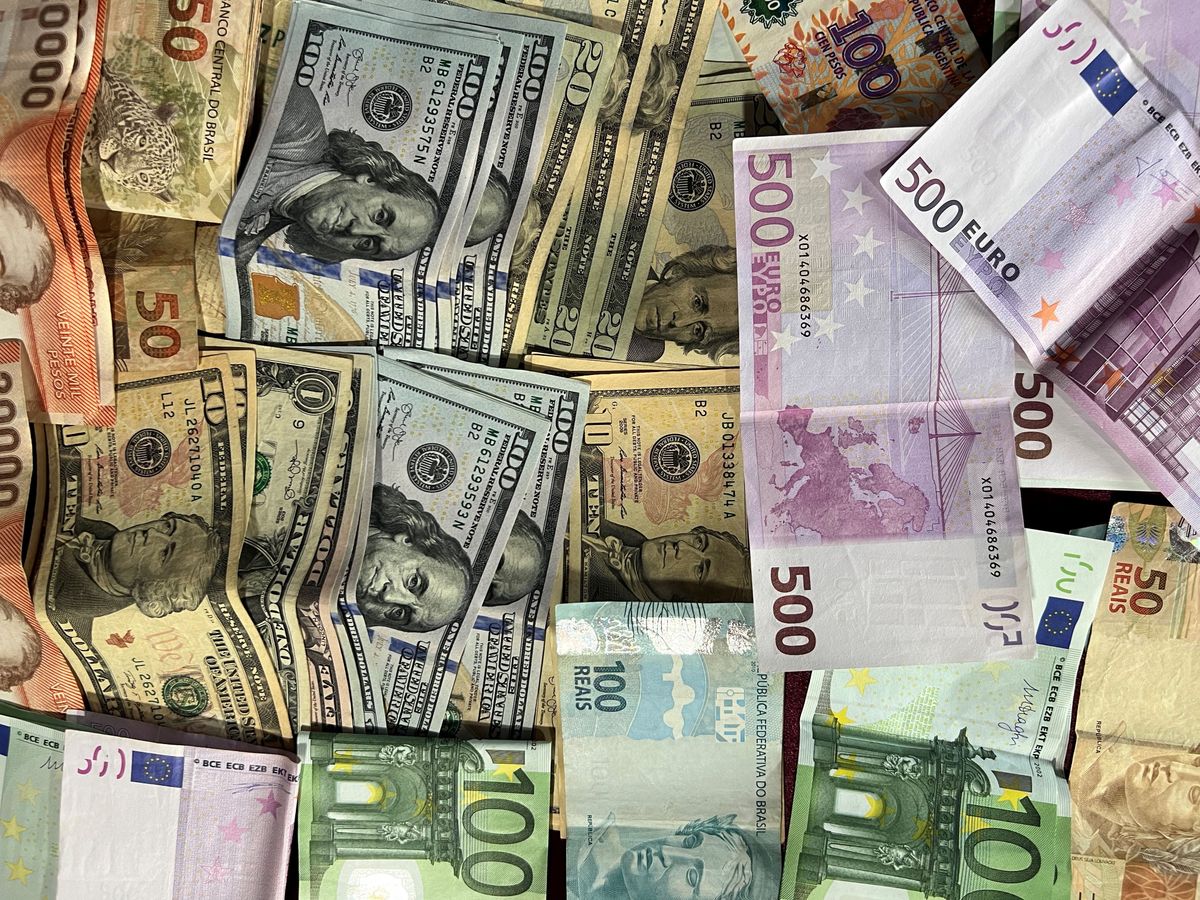 Pile of international banknotes from many countries