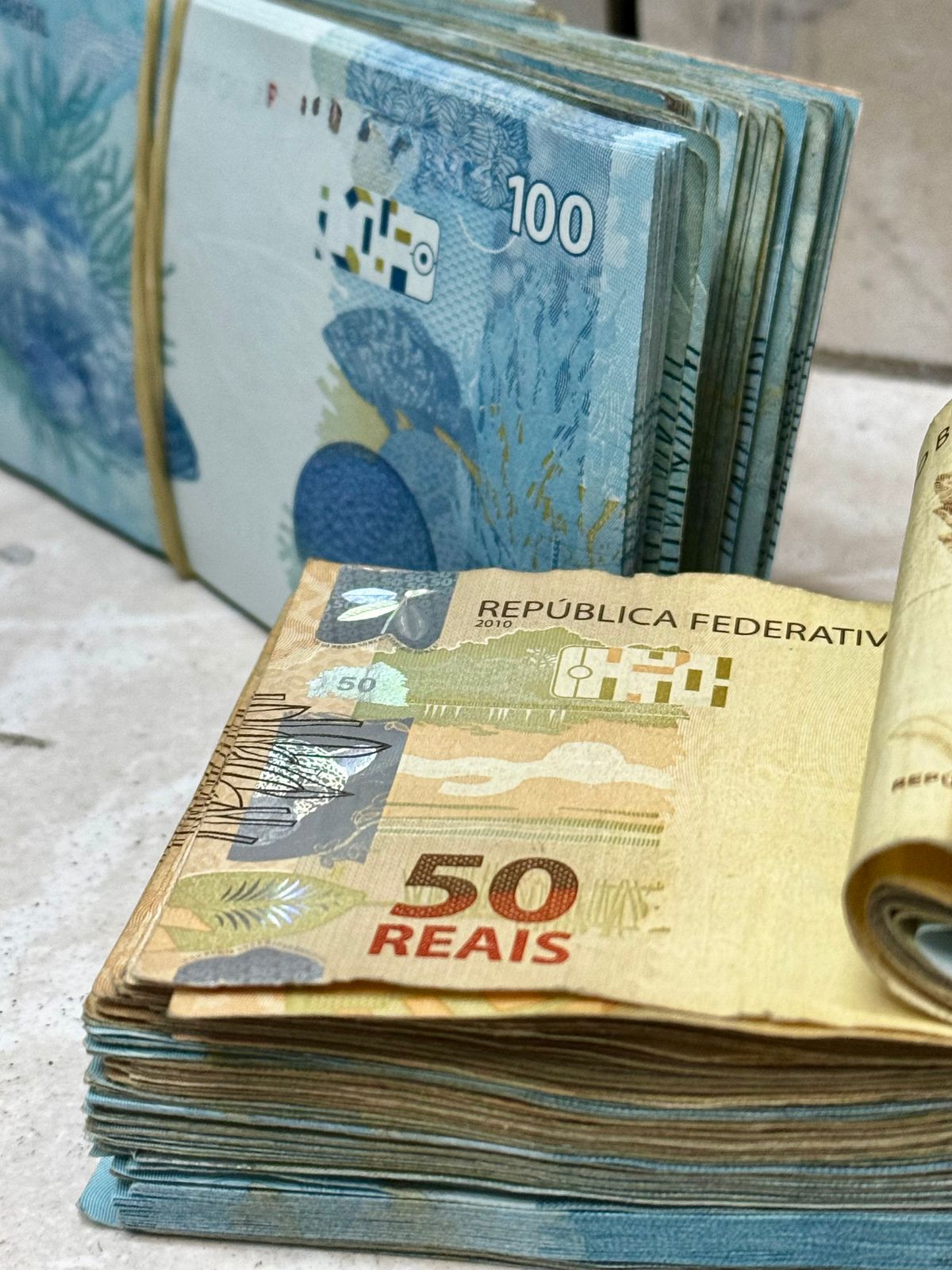 Neat stacks of high-denomination banknotes illustrating large fortunes
