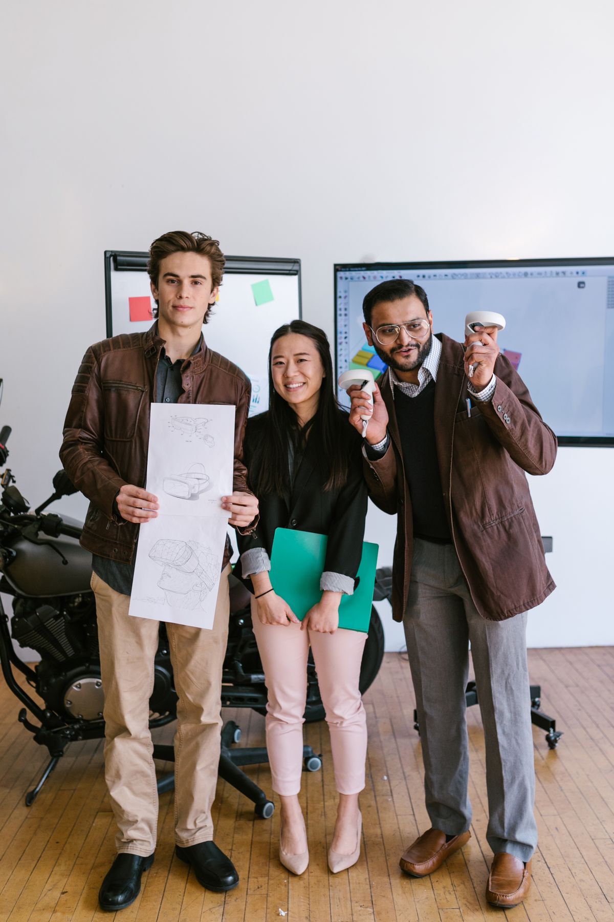 Diverse entrepreneurs collaborating on a startup idea in a bright office