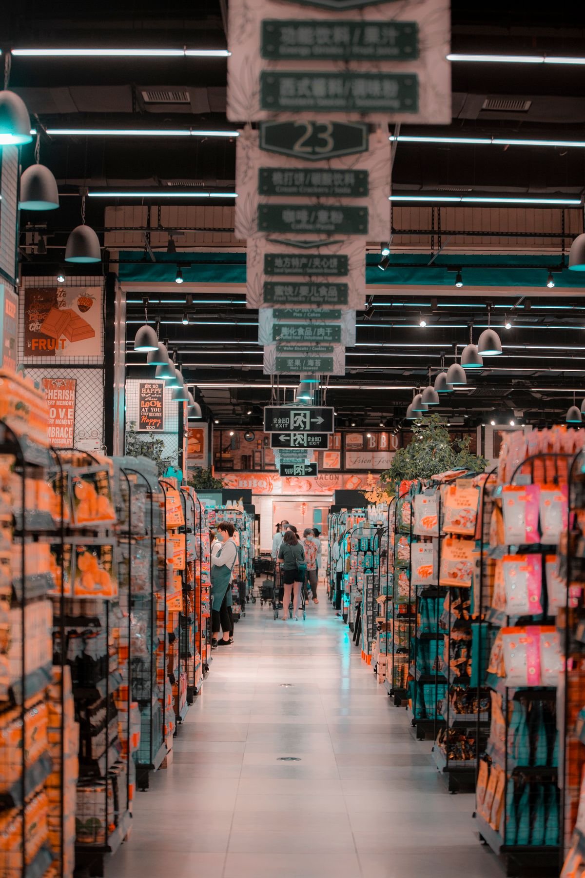 Shoppers browsing well-stocked shelves inside a busy supermarket