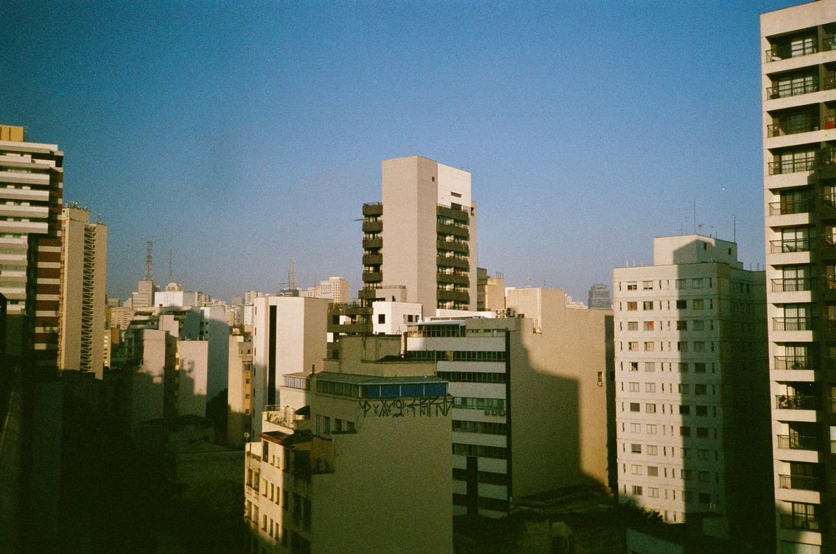 Dense city skyline of high-rise buildings representing private business in a mixed economy