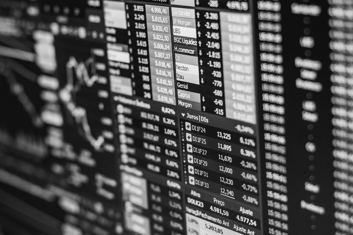 Stock-market data on a screen in black and white, illustrating economy-wide macro data