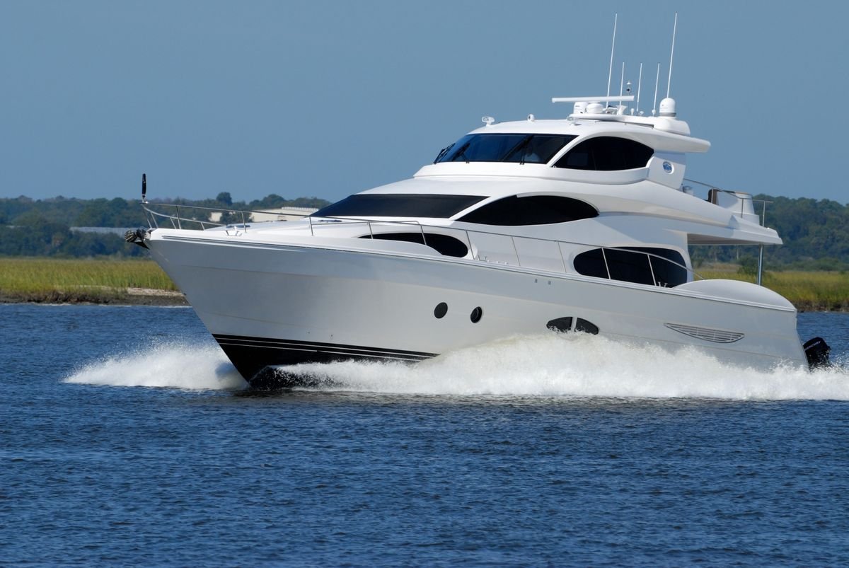 A luxury yacht cutting across open water, symbolizing concentrated national wealth
