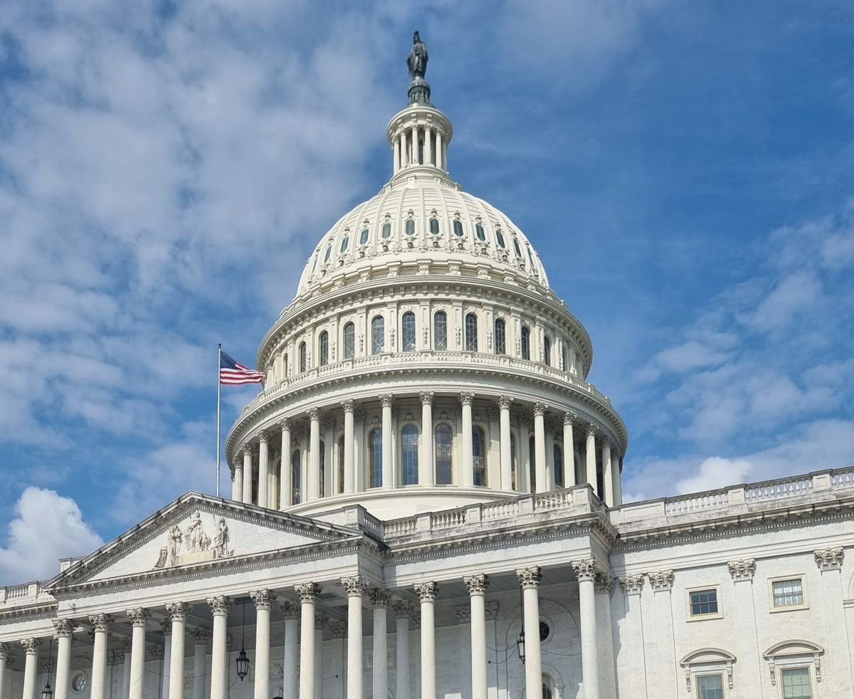 US Capitol dome against a blue sky, symbolizing government spending and national debt