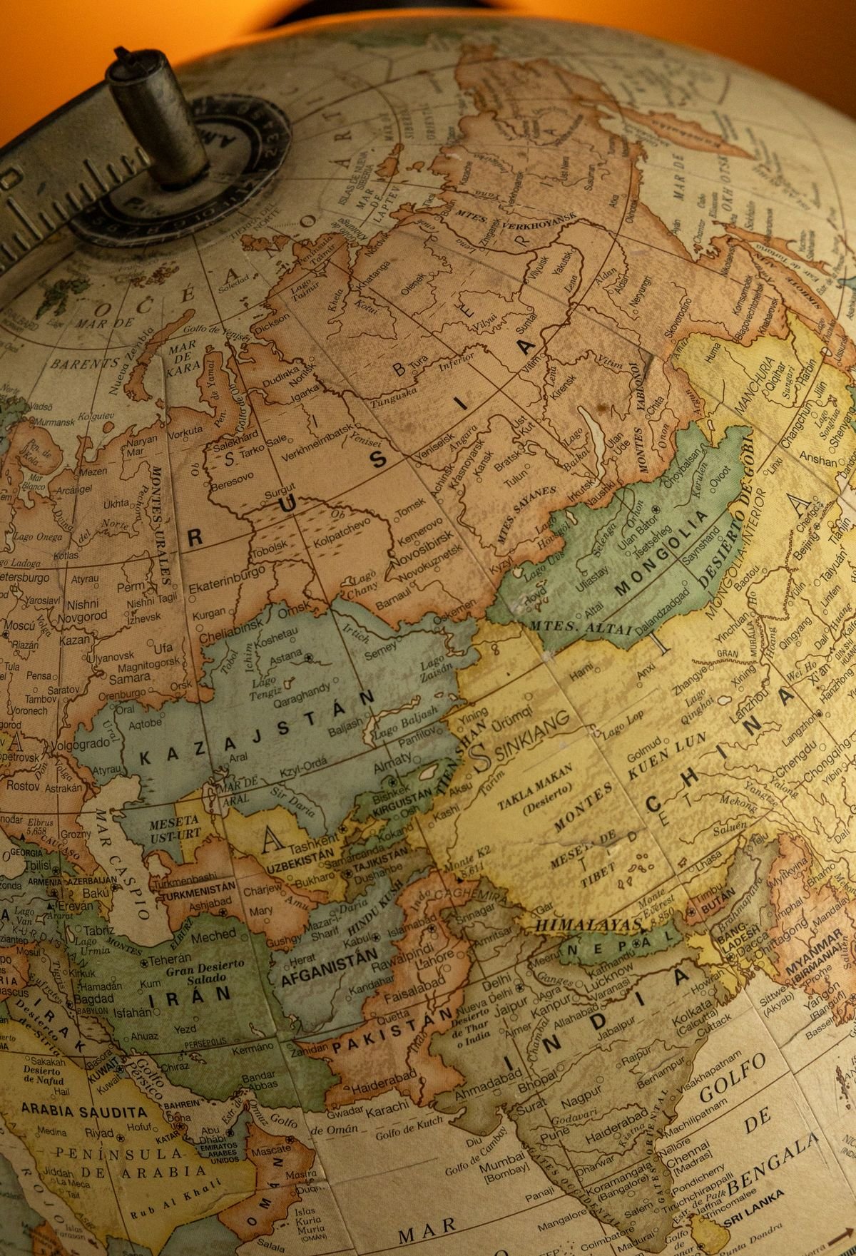 Close-up of a vintage globe highlighting Asia and Europe, representing emerging economies