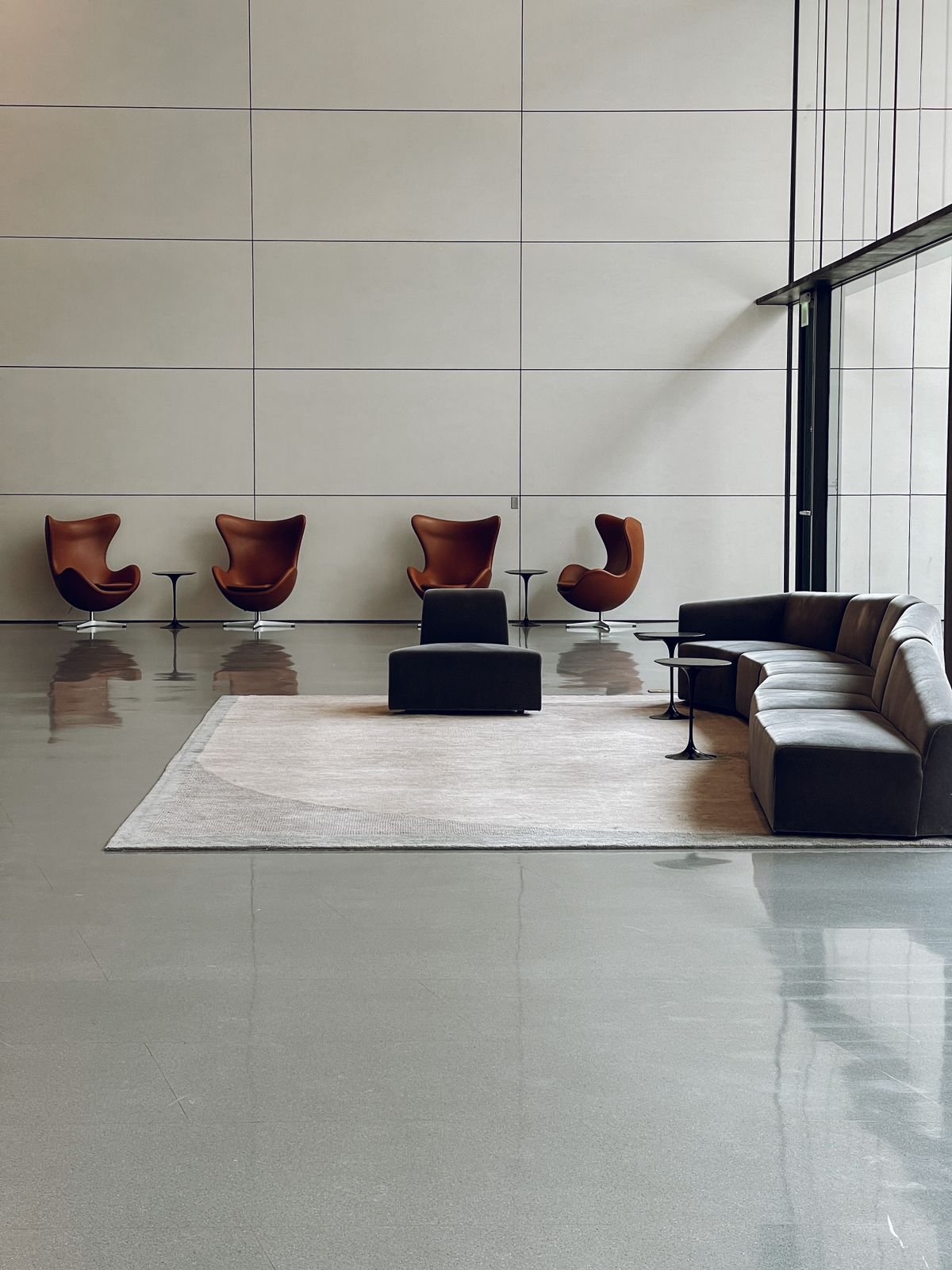 A modern trading floor with rows of desks and financial screens